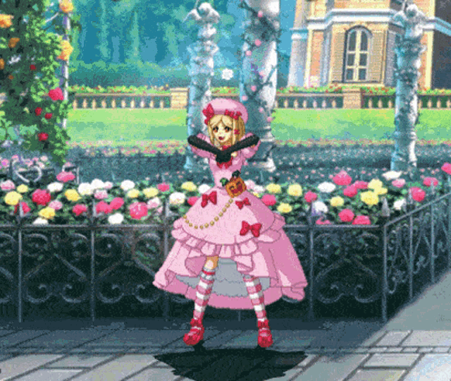 a girl in a pink dress is standing in front of a fence