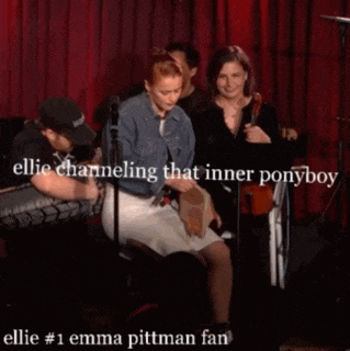a group of people sitting in front of a red curtain with a caption that says " ellie channeling that inner ponyboy "