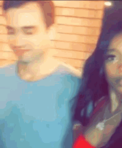 a blurry picture of a man and a woman