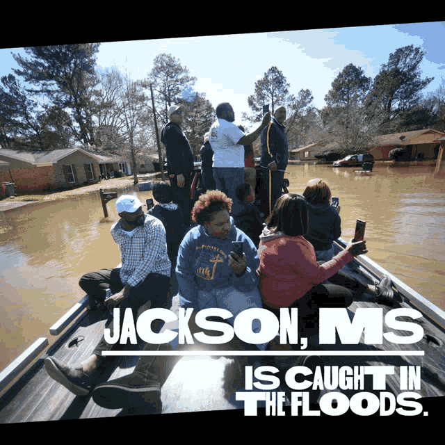 jackson ms is caught in the floods with a boat full of people