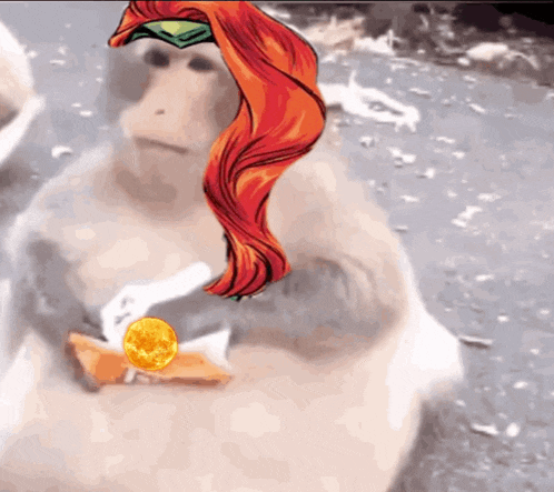 a monkey with red hair is holding a gold object