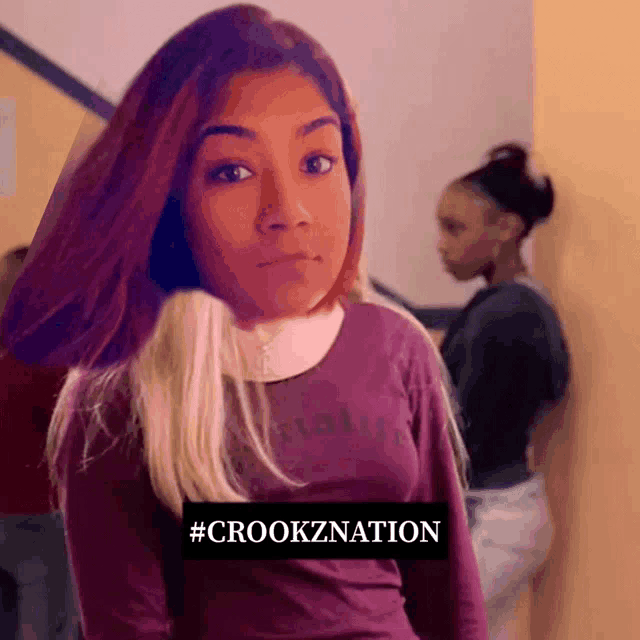 a girl wearing a purple shirt has the hashtag #crookznation on the bottom