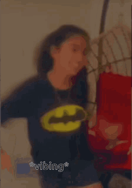 a blurry picture of a person with the word vibing on the bottom right