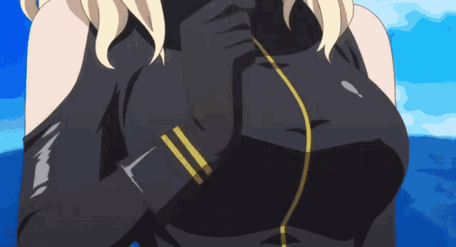 a close up of a woman 's breasts in a black and gold outfit