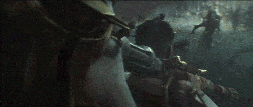 a man with a sword in his hand is being attacked by another man