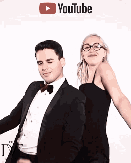 a man in a tuxedo and a woman in a black dress pose for a youtube photo