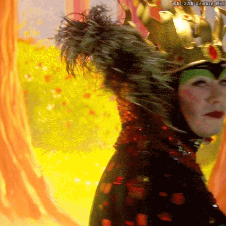 a woman is wearing a crown and feathers and has the 20th century girl written on the bottom right