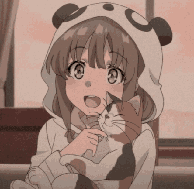 a girl wearing a panda hat holds a cat