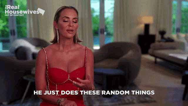 a woman in a red dress with the words he just does these random things
