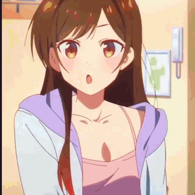 a close up of a girl in a pink tank top and a purple hoodie .