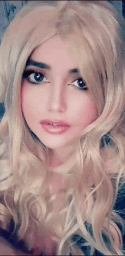 a close up of a woman 's face with blonde hair
