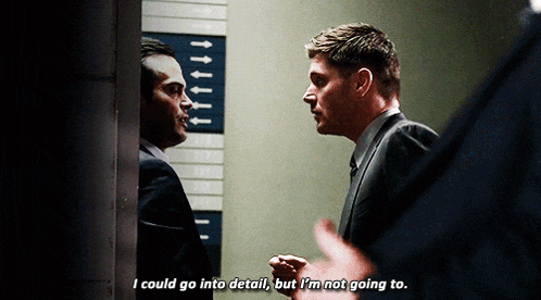 a man in a suit says i could go into detail but i 'm not going to while another man looks on