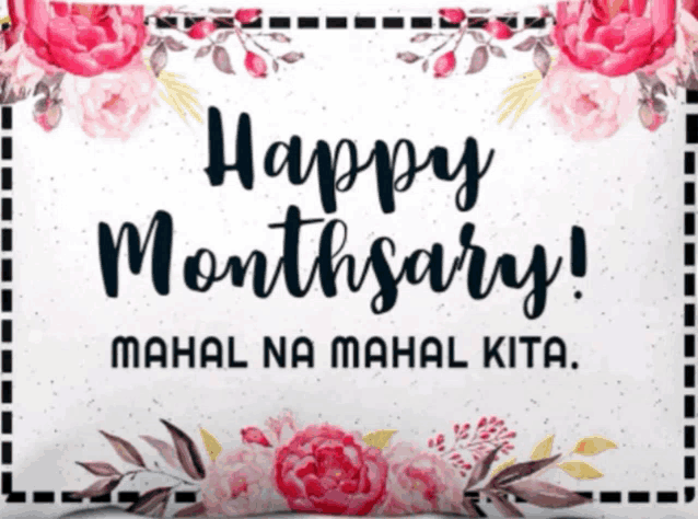 a white pillow with pink flowers and the words happy monthary mahal na mahal kita