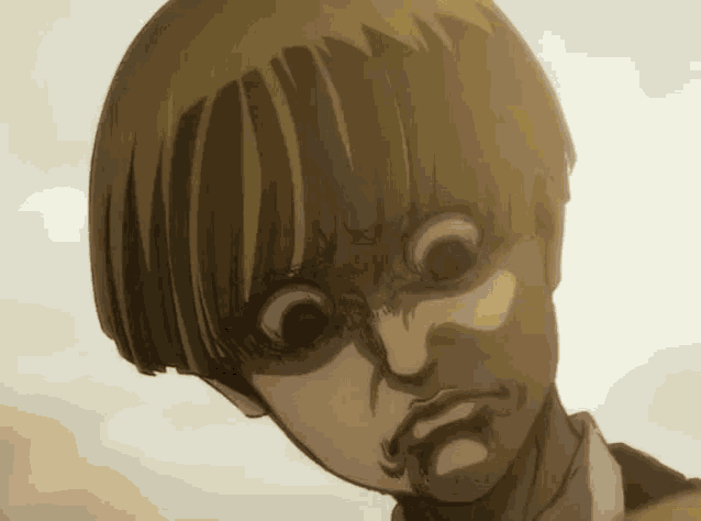 a close up of a person 's face with a very angry expression .