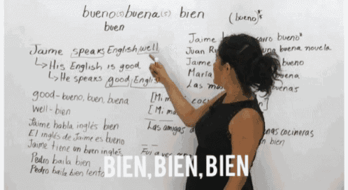 a woman writes on a whiteboard with the words bien bien bien on the bottom