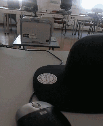 a mouse pad with a sticker on it that says ' a ' on it
