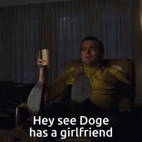 a man is sitting in a chair and pointing at something with the words hey see doge has a girlfriend