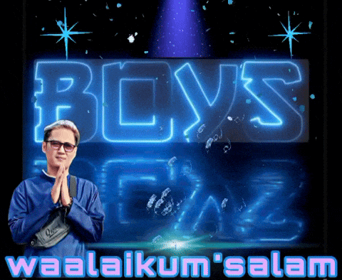 a man stands in front of a sign that says " boys "