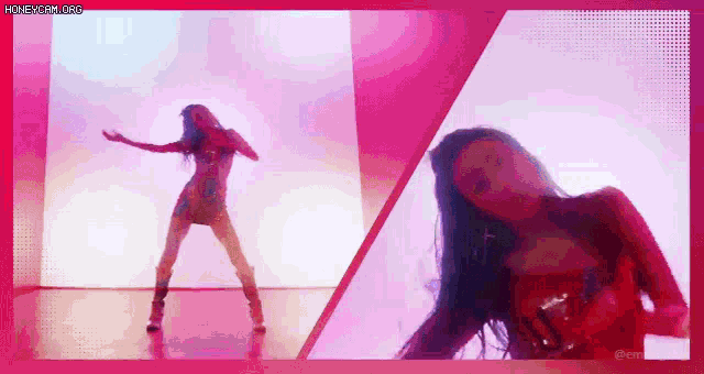 a woman is dancing in front of a pink wall .