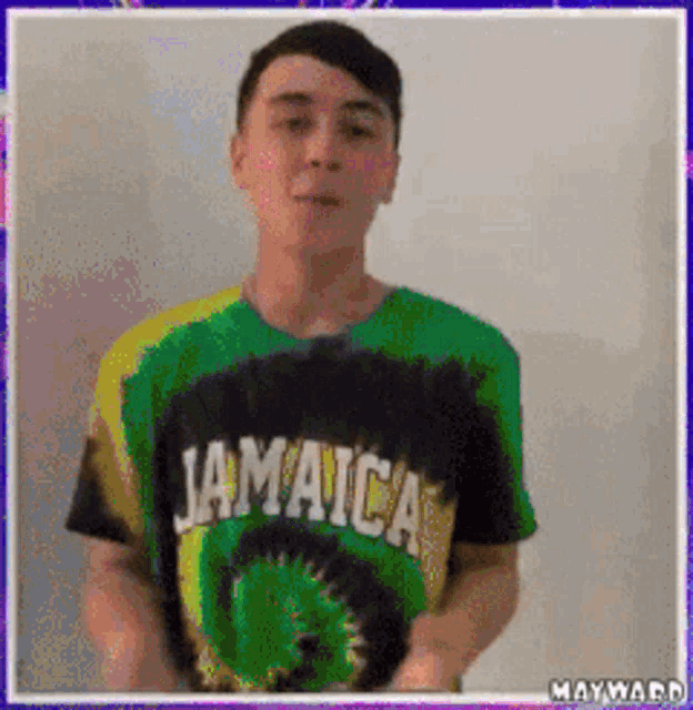 a man wearing a jamaica t-shirt is dancing