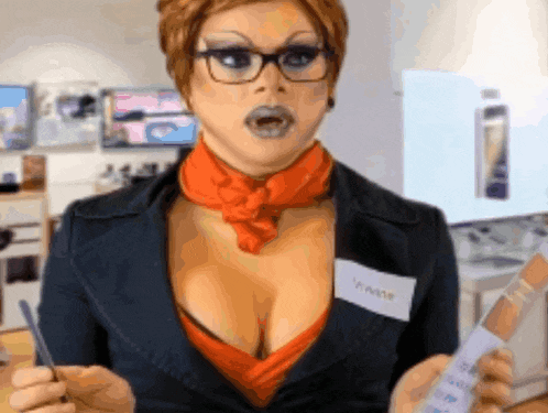 a woman wearing glasses and an orange scarf has a name tag that says yanne