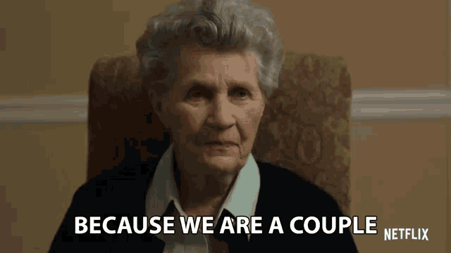 an elderly woman is sitting in a chair and saying because we are a couple
