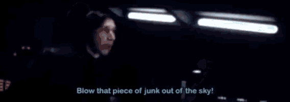 a man is blowing a piece of junk out of the sky while driving a car .