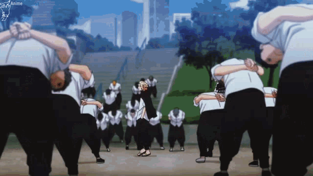 a group of people are standing in a line with their hands on their heads