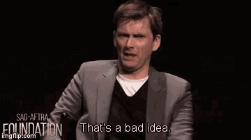 a man in a suit is making a funny face and saying `` that 's a bad idea '' .