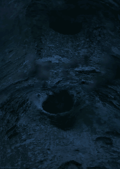 a dark blue background with a few spots of light on it and a few holes in it