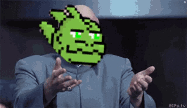 a man in a suit with a green pixelated face on his face