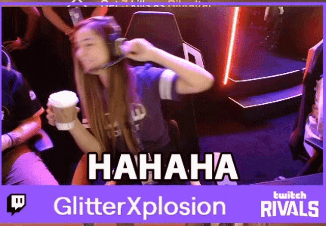 a woman is laughing while holding a cup of coffee in front of a banner for twitch rivals