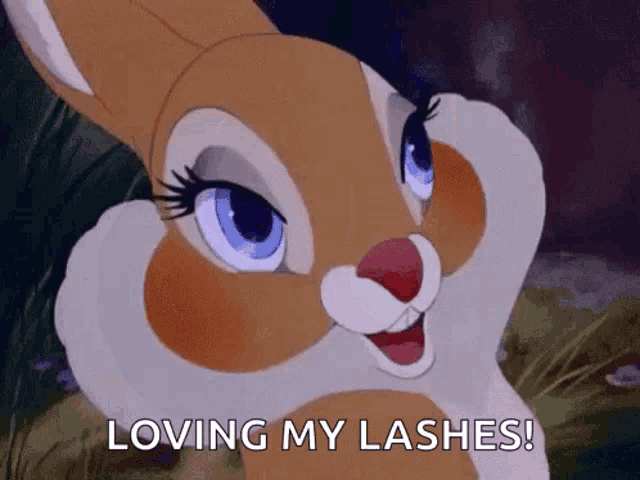 a cartoon bunny is smiling and saying loving my lashes