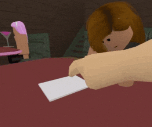 a person is holding a piece of paper in front of a woman