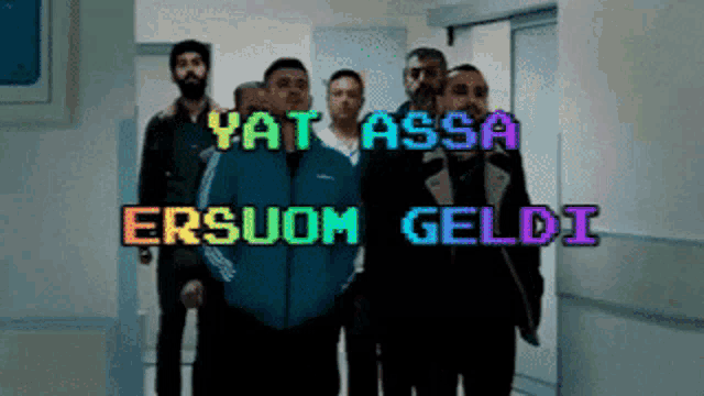 a group of men standing in a hallway with the words yatassa ersuom geldi written on the bottom