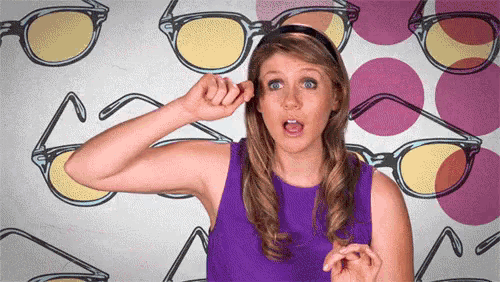 a woman in a purple dress is scratching her ear in front of glasses