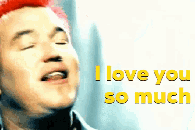 a man with red hair says i love you so much in yellow letters