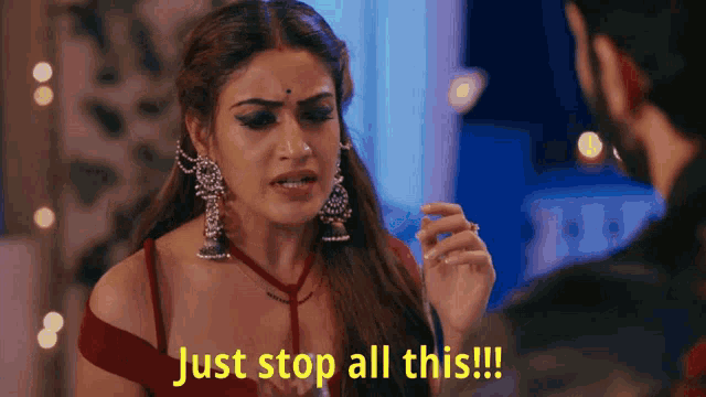 a woman says just stop all this while looking at a man