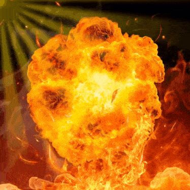 a large explosion of flames and smoke against a dark background