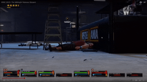 a man is laying on the ground in front of a sign that says ' wrestling '