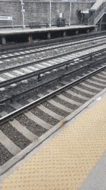 a train station with a sign that says ' forbes ' on it