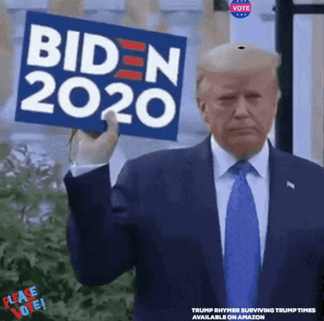 a man in a suit and tie is holding a biden 2020 sign in his hand .