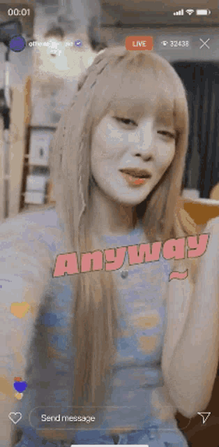 a girl with blonde hair is on a live stream and says " anyway " in pink