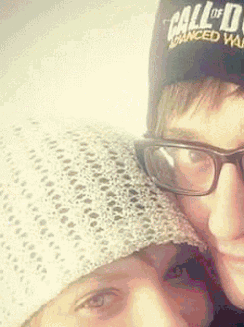 a man wearing a call of duty advanced warfare hat
