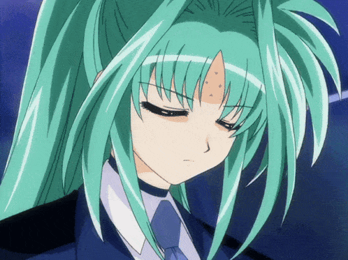 a close up of a girl with green hair