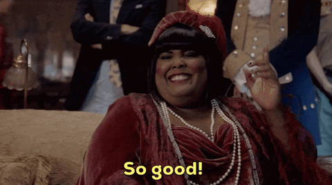 a woman sitting on a couch says so good