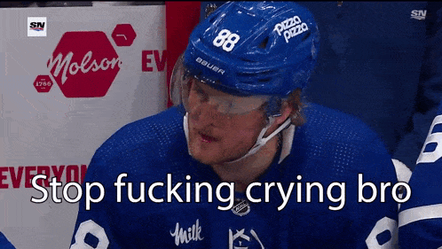 a hockey player with the number 88 on his helmet is crying