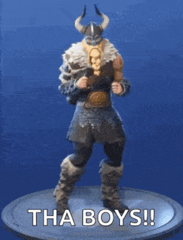 a figurine of a viking dancing with the words tha boys ! written on it .