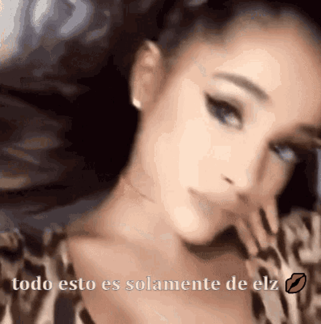a close up of a woman with the words todo esto es solamente de elz