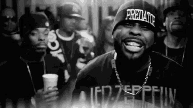 a man wearing a beanie that says predator